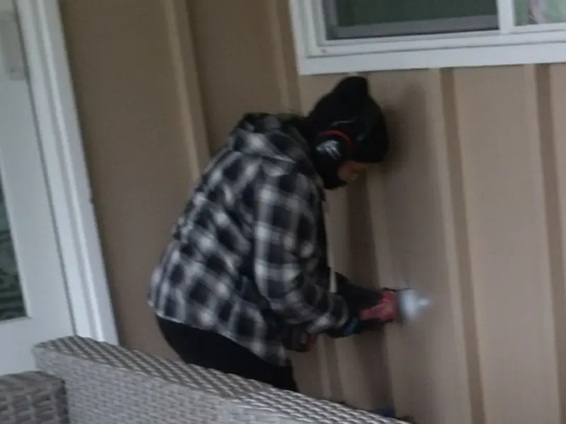 Professional electrician installing an exterior outlet in Fort Knox